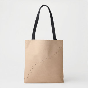 Aerial photography of footprints in the sand tote bag