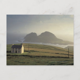 aerial view of a cottage on a hill by the sea postcard