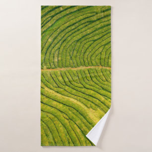 Aerial view of green open field bath towel