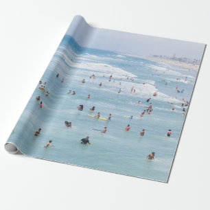 AERIAL VIEW OF GROUP OF PEOPLE SWIMMING ON BEACH WRAPPING PAPER