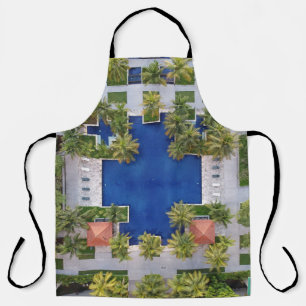 Aerial view of pool surrounded by palm trees apron