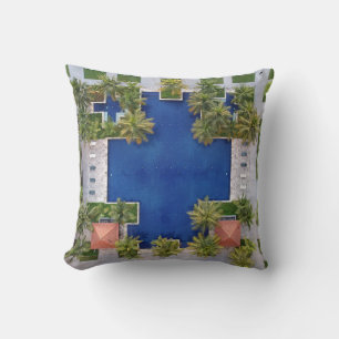 Aerial view of pool surrounded by palm trees cushion