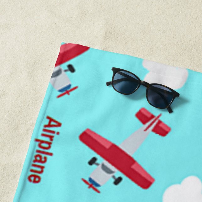 Aeroplane pattern on blue beach towel (In Situ)