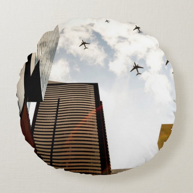 Aeroplanes flying over buildings round cushion (Front)