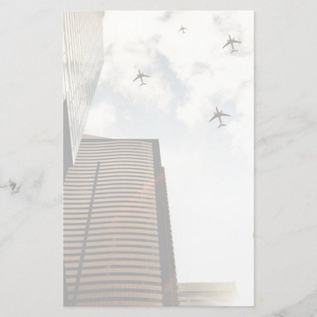 Aeroplanes flying over buildings stationery (Front)