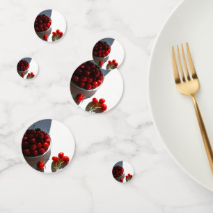 Aesthetic still life with ripe cherries on a white confetti