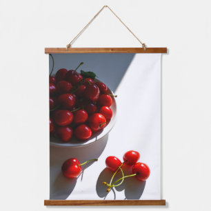 Aesthetic still life with ripe cherries on a white hanging tapestry