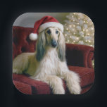 Afghan Hound Wearing a Santa Claus Hat Paper Plate<br><div class="desc">A beautiful Afghan hound dog with long,  silky fur lounges on a red velvet couch,  wearing a festive Santa hat</div>