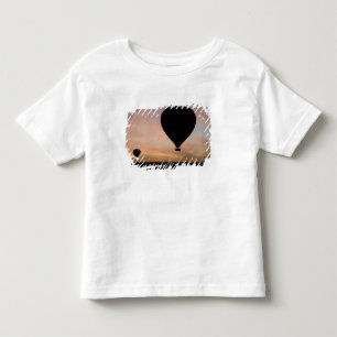 Africa, Kenya, Masai Mara. Two balloons glide Toddler T-Shirt