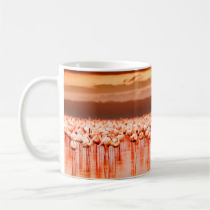 African flamingos in the lake over beautiful sunse coffee mug