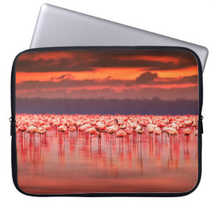African flamingos in the lake over beautiful sunse laptop sleeve