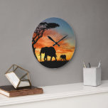 African Safari Sunset Elephant Silhouette Art Large Clock<br><div class="desc">Beautiful contemporary photography of African sunset, and silhouette of tree and elephant. This design is for the lover of African nature, animals, wildlife, elephants, safari vacations or bright and vibrant summer colours. Classy and fashionable decor item for those who love decorating their master or children's bedroom, living or family room,...</div>