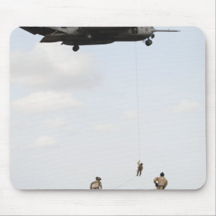 Air Force pararescuemen conduct a combat insert Mouse Mat