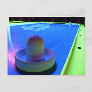 Air Hockey table and mallet with neon lighting Postcard