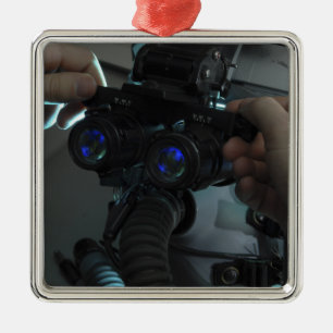 Airman adjusts the eyespan metal tree decoration