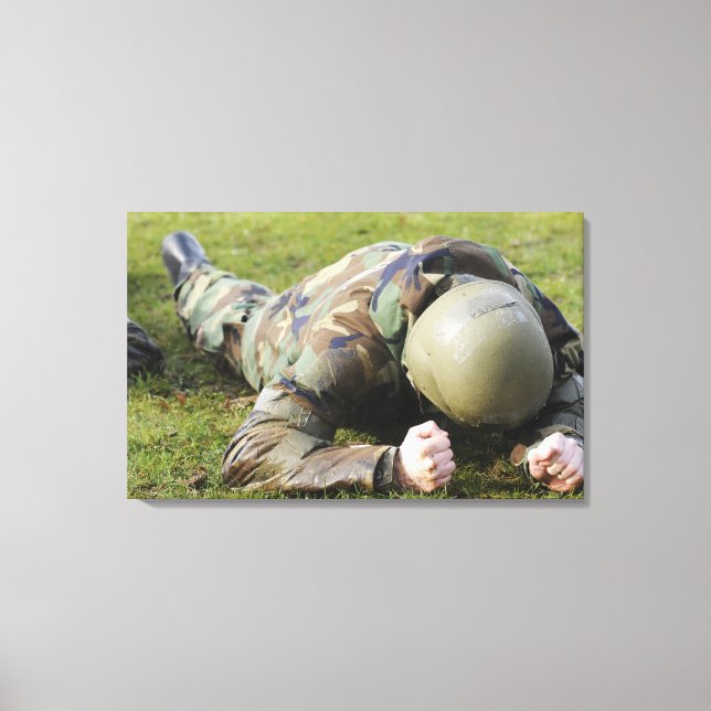 Airman crawls through a wet field canvas print (Front)