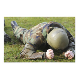 Airman crawls through a wet field photo print