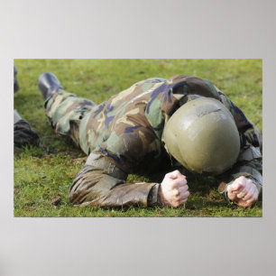 Airman crawls through a wet field poster