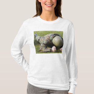 Airman crawls through a wet field T-Shirt