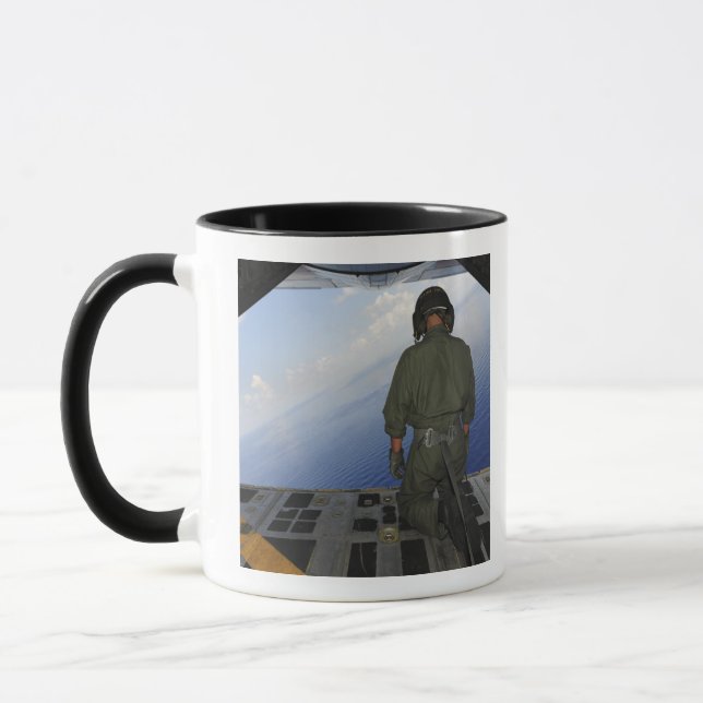 Airman observes the waters of the Gulf of Mexic Mug (Left)