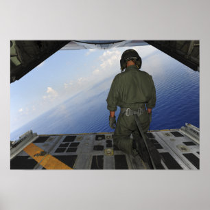 Airman observes the waters of the Gulf of Mexic Poster