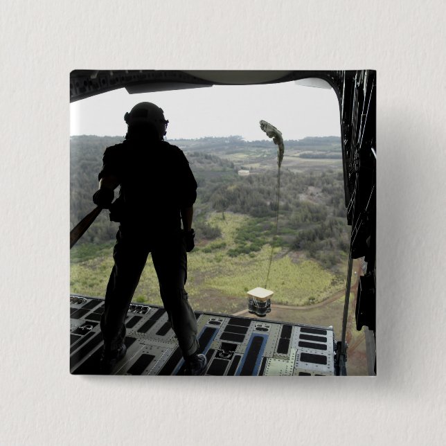 Airman watches a practice bundle fall 15 cm square badge (Front)