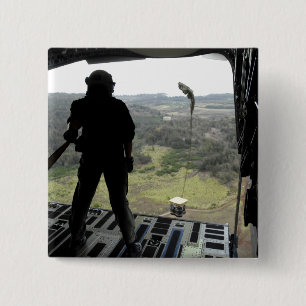 Airman watches a practice bundle fall 15 cm square badge