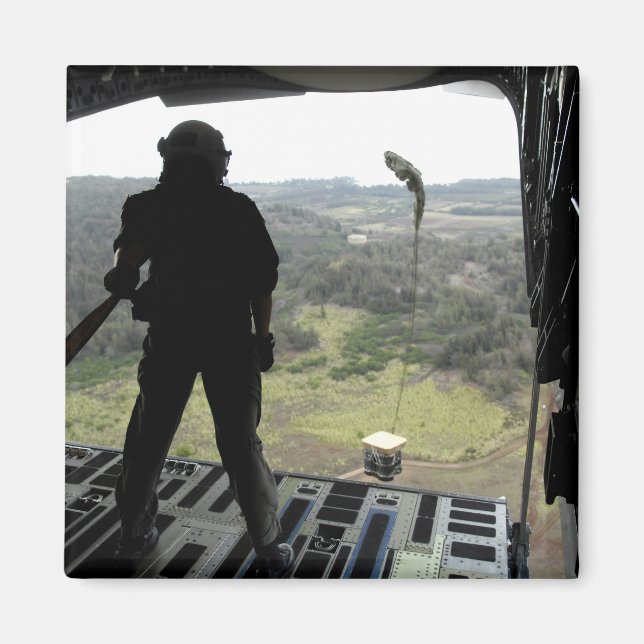 Airman watches a practice bundle fall magnet (Front)