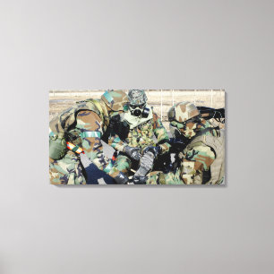 Airmen assist a Republic of Korea Army soldier Canvas Print