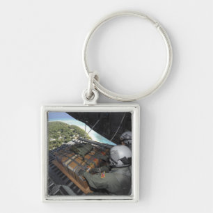 Airmen push out a pallet of donated goods 2 key ring