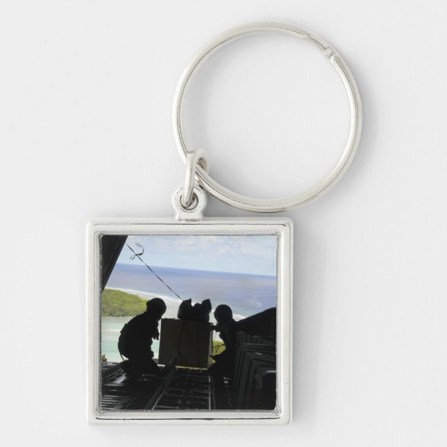 Airmen push out a pallet of donated goods key ring (Front)