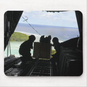 Airmen push out a pallet of donated goods mouse mat