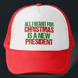 All I Want for Christmas is a New President Funny Trucker Hat<br><div class="desc">All I Want for Christmas is a new president cap. Let's impeach this POTUS and get this resistance started. A funny Anti Donald Trump holiday gift in green and red writing to resist. Political humor holiday hat.</div>
