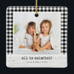 All Is Calm(ish) • Buffalo Check Photo Christmas Ceramic Ornament<br><div class="desc">A cosy, tongue-in-cheek holiday ornament for real families—because things are calm… ish. This square photo ornament features a classic black-and-white buffalo check frame, a whitewashed wood caption bar, and the playful headline “all is calm(ish).” Swap in your photo, update names and year, and you’ve got a stylish keepsake that fits...</div>