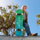 Aloha blue green pineapple pattern script modern skateboard<br><div class="desc">“Aloha”. Bring a bit of the Hawaiian islands to your city streets whenever you use this brightly colored, chic, striking, stylish, modern skateboard sporting crisp, white handwritten script typography over a distressed graphic, pineapple pattern in a vivid turquoise, blue and green ombre. Makes a fun and stylish statement every time...</div>