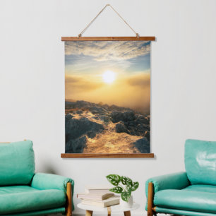 Amazing sunset above clouds and sun lit rocks hanging tapestry