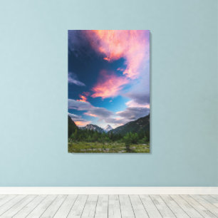 Amazing sunset clouds over mountain Mangart Canvas Print