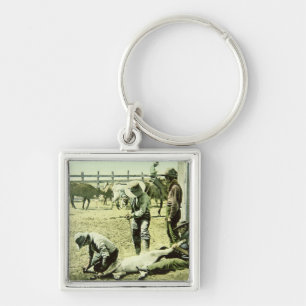 American cowboys branding a calf, c.1900 (photo) key ring