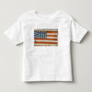 American flag painted onto fireworks stand near toddler T-Shirt