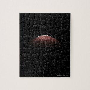 American football ball on black background jigsaw puzzle