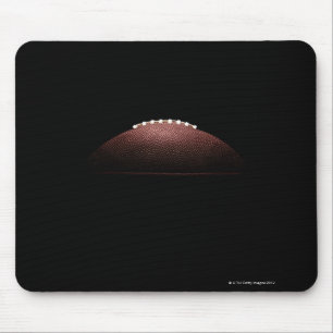 American football ball on black background mouse mat