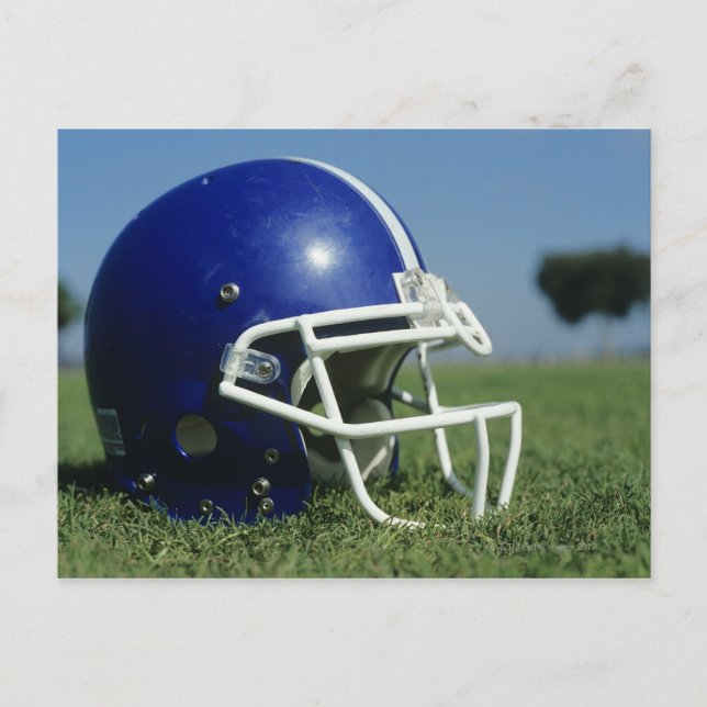 American football helmet in grass,close-up postcard (Front)