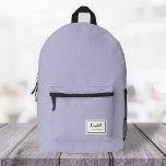 American Nostalgia Classic Simple Minimal Lilac Printed Backpack<br><div class="desc">This american nostalgia style classic backpack in lilac purple features a patch style emblem with a monogram name and framed border,  featuring informal handwritten script and modern block typography. The text can be customised with your name for a design as unique as you are!</div>