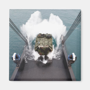 Amphibious assault vehicles disembark from USNS Magnet