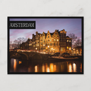 Amsterdam canal houses at dusk edge postcard