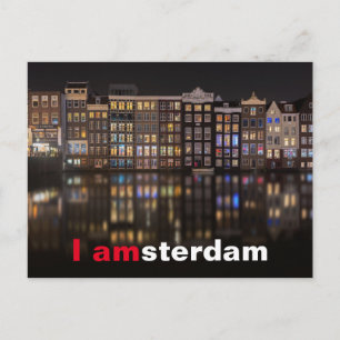 Amsterdam houses with colourful lights in the nigh postcard