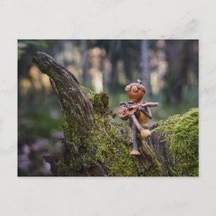 An acorn elf guitarist in the forest. postcard