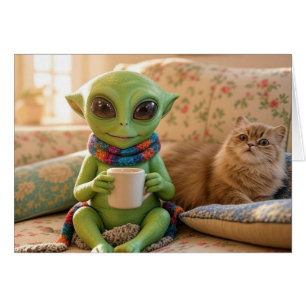 An adorable alien and pet cat coffee on the couch