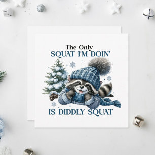 An adorable raccoon lounging happily holiday card