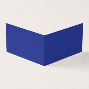 an aeroplane flying in the sky with a blue backgro